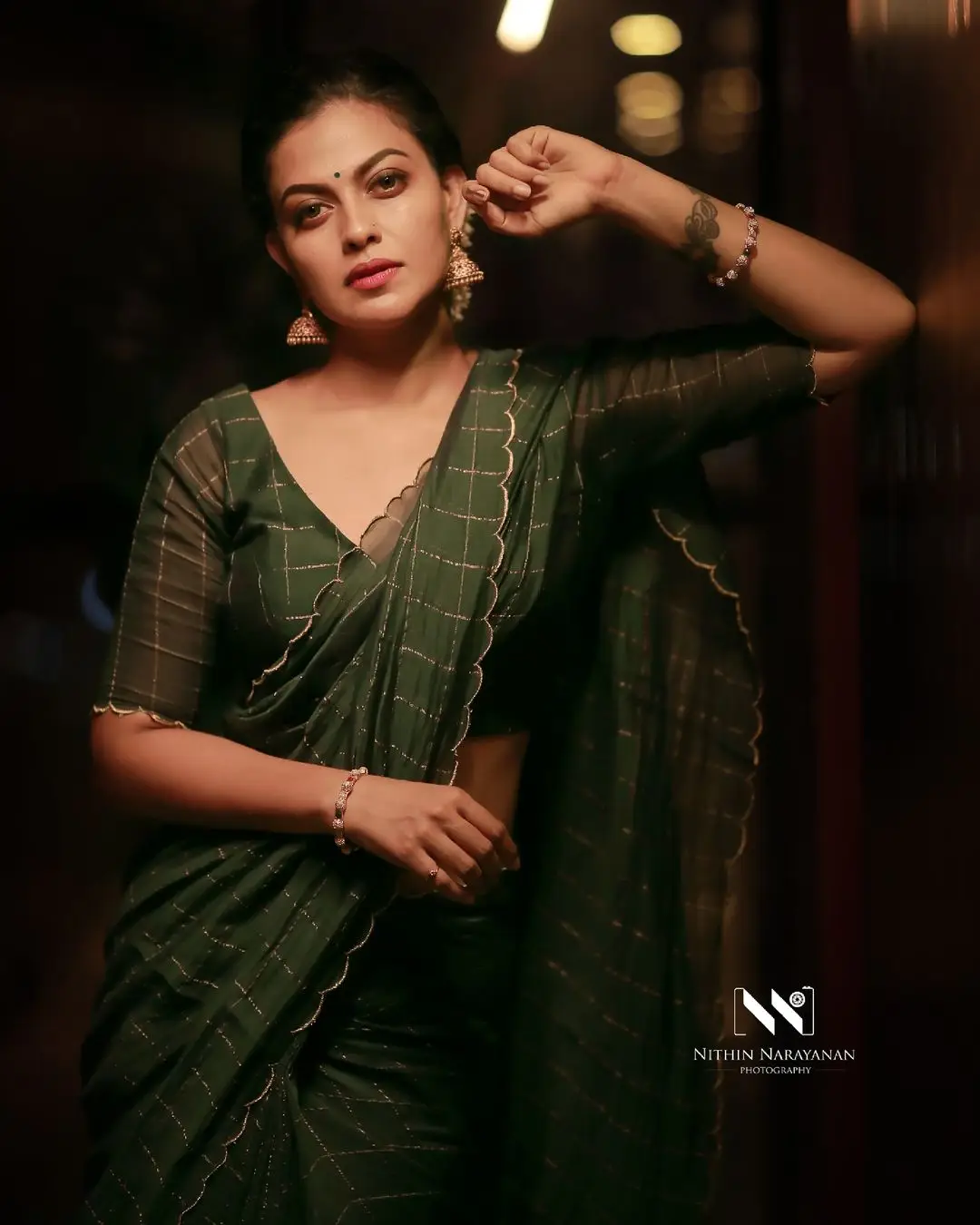 Anusree Nair Wearing Beautiful Earrings Jewellery Green Saree Blouse